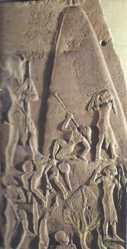 The stele of Naram-Sin, King of Agade, who is shown standing before a mountain, his feet resting on slain enemies, while soldiers ascend a wooded path.