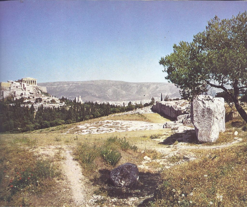 The Pnyx at Athens, where Themistocles addressed the assembled citizens. In the distance is the Acropolis, the temple of Athena Parthenos, the most sacred spot in Athens. 