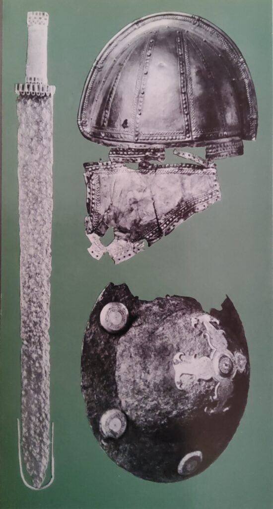 The weapons of barbarian warriors; a two-edged, goldhandled sword found in France and probably made by a Byzantine craftsman, which tradition attributes to King Theodoric; a silver Moldavian helmet, possibly Hunnish; and the boss of a shield.